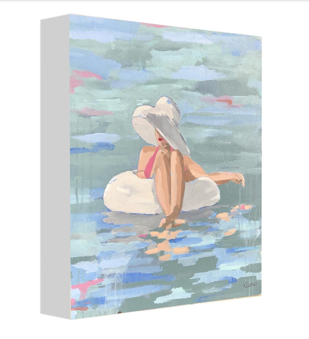 Art print titled PRISCILLA from the BATHING BEAUTIES COLLECTION by Kristin Cooney, inspired by 1950's beach fashion and femininity. The PRISCILLA fine art print by Kristin Cooney—featuring a glamorous woman in a pink swimsuit and sunhat, gracefully lounging in a pool float. A nod to vintage glamour with free U.S. shipping and multiple size options. Created from an original painting by Kristin Cooney.