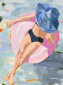 Kristin Cooney's fine art giclee print of a pretty woman in a bikini floating in an innertube in a beautiful water scene, has a feminine palm beach vibe and is the perfect art to add some fun and elegance any home decor, interior design.  Printed on Archival Matte Paper Metallic Bamboo frame or natural wood frame.