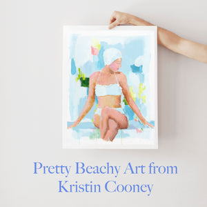 Kristin Cooney's fine art print from her Bathing Beauties collection, inspired by 1950's beach fashion and femininity. Woman in blue bikini and swim cap, synchronized swimmer in pool. Elegant nostalgic fashion art to add beauty to any home decor, interior design, beach house art, spa art, female figure art, bedroom art