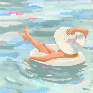 Kristin Cooney's fine art print from her Bathing Beauties collection, inspired by 1950's beach fashion and femininity. The HANNAH fine art print by Kristin Cooney—featuring a glamorous woman in a pink swimsuit and sunhat, gracefully lounging in a pool float. A nod to vintage glamour with free U.S. shipping and multiple size options. Created from an original painting by Kristin Cooney.