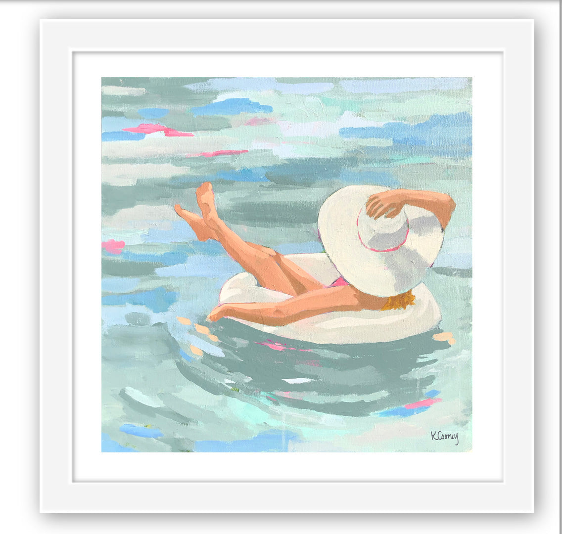 Kristin Cooney's fine art print from her Bathing Beauties collection, inspired by 1950's beach fashion and femininity. The HANNAH fine art print by Kristin Cooney—featuring a glamorous woman in a pink swimsuit and sunhat, gracefully lounging in a pool float. A nod to vintage glamour with free U.S. shipping and multiple size options. Created from an original painting by Kristin Cooney.