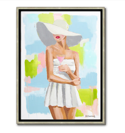 Kristin Cooney's fine art giclee print of a pretty woman in a white bathing suit sipping a pink cocktail, with a sunhat on, has a feminine palm beach vibe and is the perfect art to add some fun and elegance any home decor, interior design.  A nod to vintage glamour with free U.S. shipping and multiple size options. Created from an original painting by Kristin Cooney.