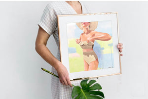 The NICOLE  fine art print by Kristin Cooney—featuring a glamorous woman in a high waisted bikini swimsuit.  A nod to vintage glamour with free U.S. shipping and multiple size options. Created from an original painting by Kristin Cooney. Fine art prints in a coastal theme to add beauty to any home decor, interior design, beach house art, spa art, female figure art, bedroom art