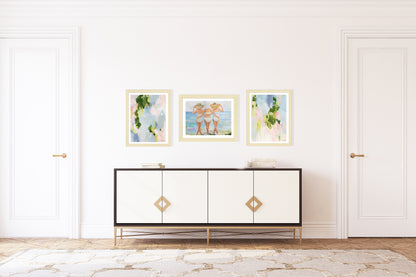 An artwork print featuring three women in swimsuits and straw hats, viewed from behind, walking on a beach with a stylized, painterly approach in pastel colors. Created from an original painting by Kristin Cooney